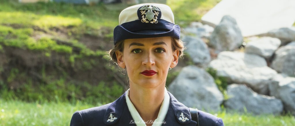 A confident woman in an army officer uniform, standing tall and proud. Her uniform is sharply pressed, and she exudes authority and professionalism, embodying the strength and leadership of women in the military.